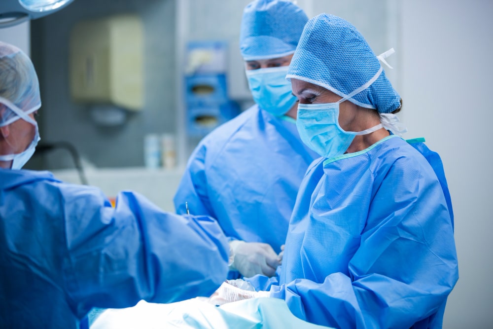 surgeons-performing-operation-operation-room-min